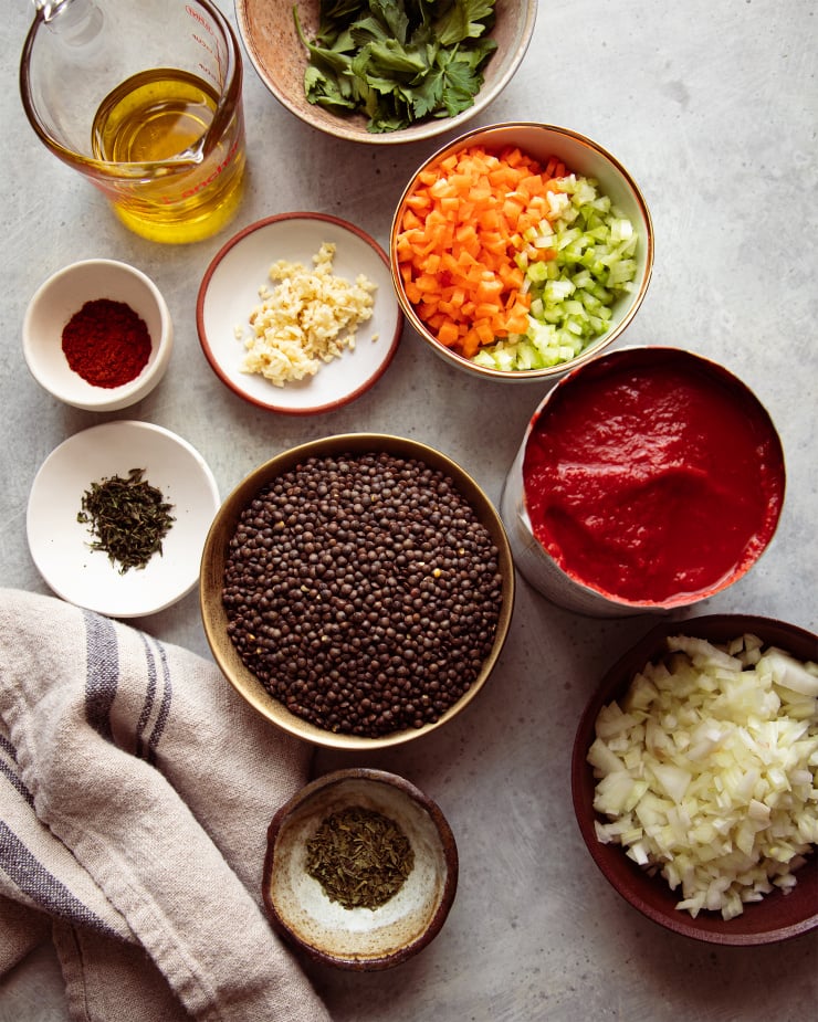 Image taken from overhead displays prepped ingredients for a lentil soup.