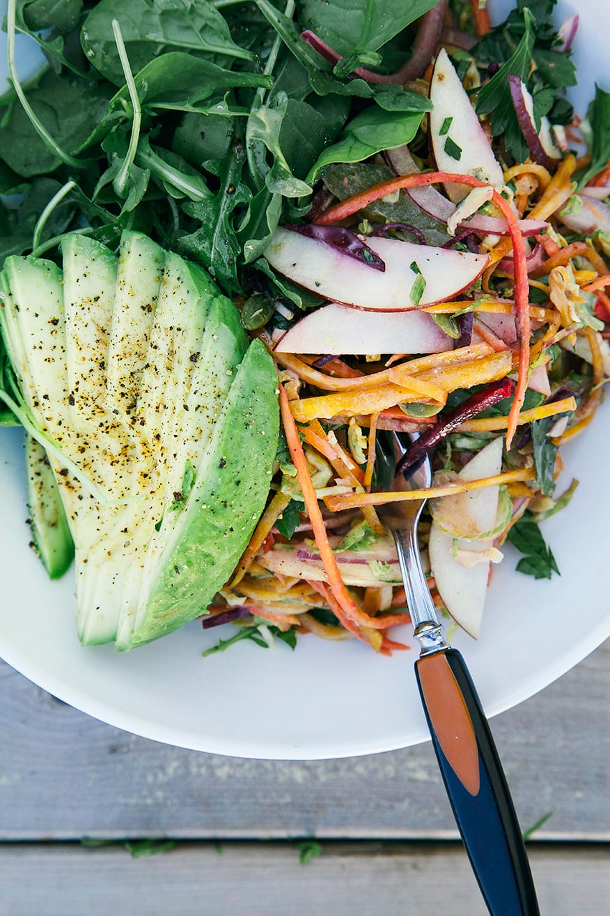An overhead shot of a shredded colourful salad in a bowl.