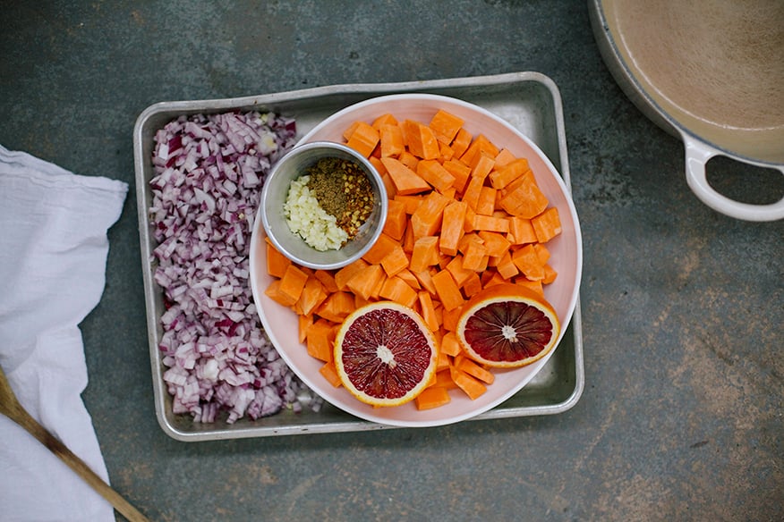 Image shows prepped ingredients for a sweet potato soup.