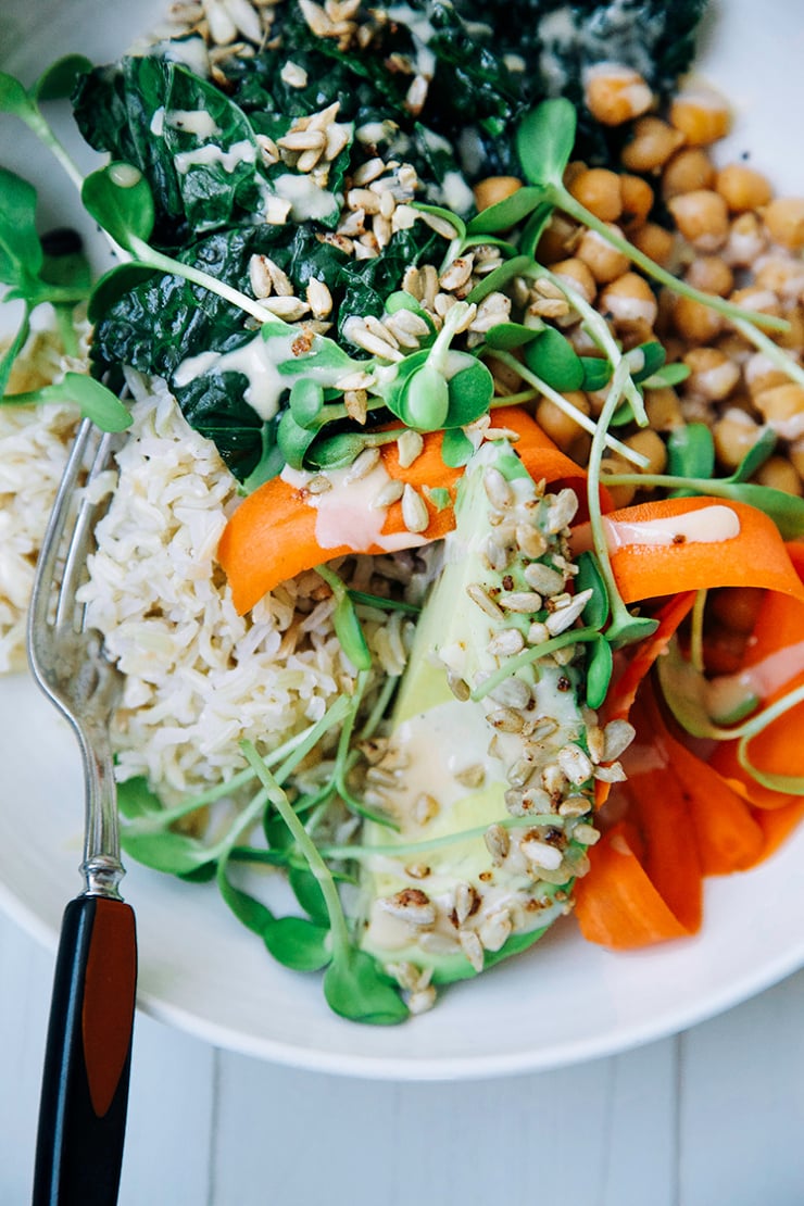 amazing tahini dressing + a healthy grain bowl with kale, chickpeas, brown rice, and carrot.