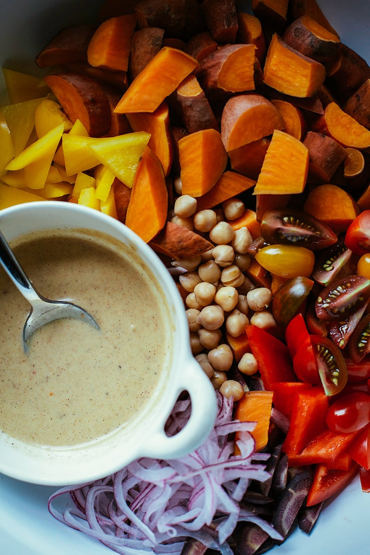 An overhead shot of ingredients for a sweet potato sunshine salad, before being mixed.