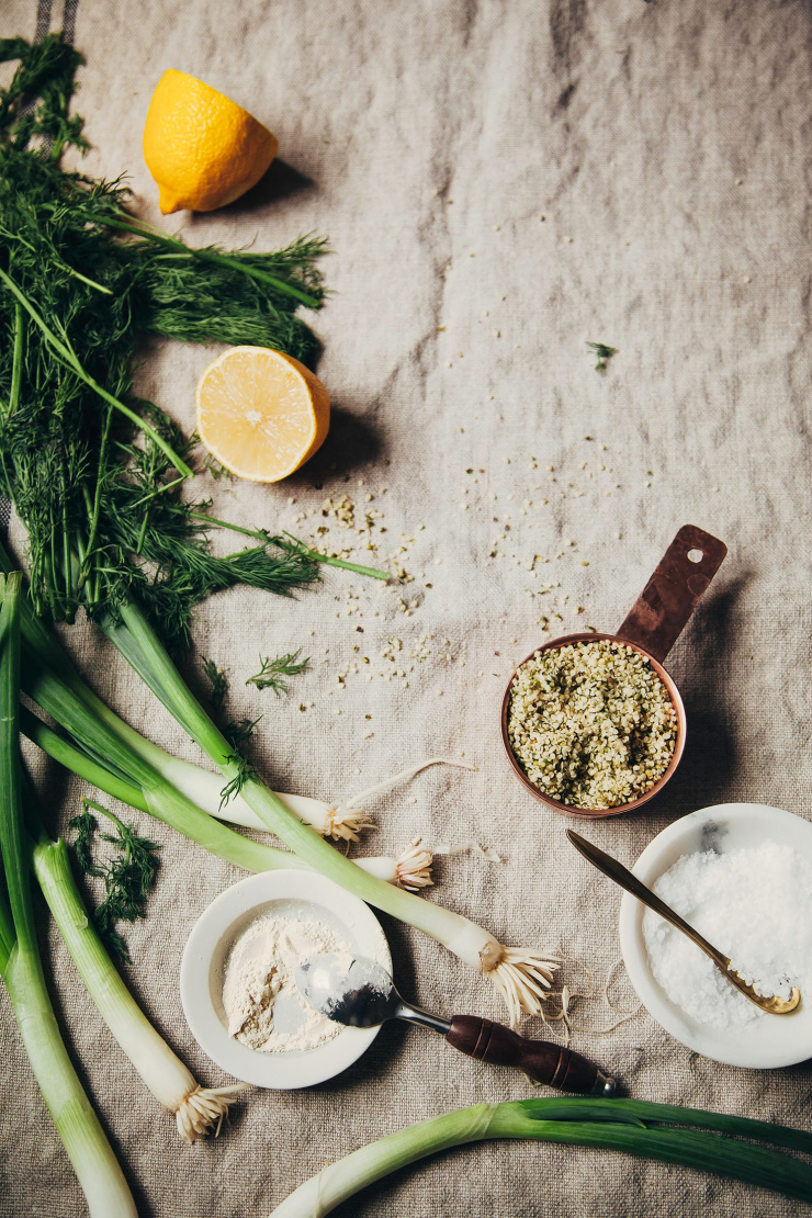 An overhead shot of ingredients for a vegan ranch sauce with hemp seeds as the base.