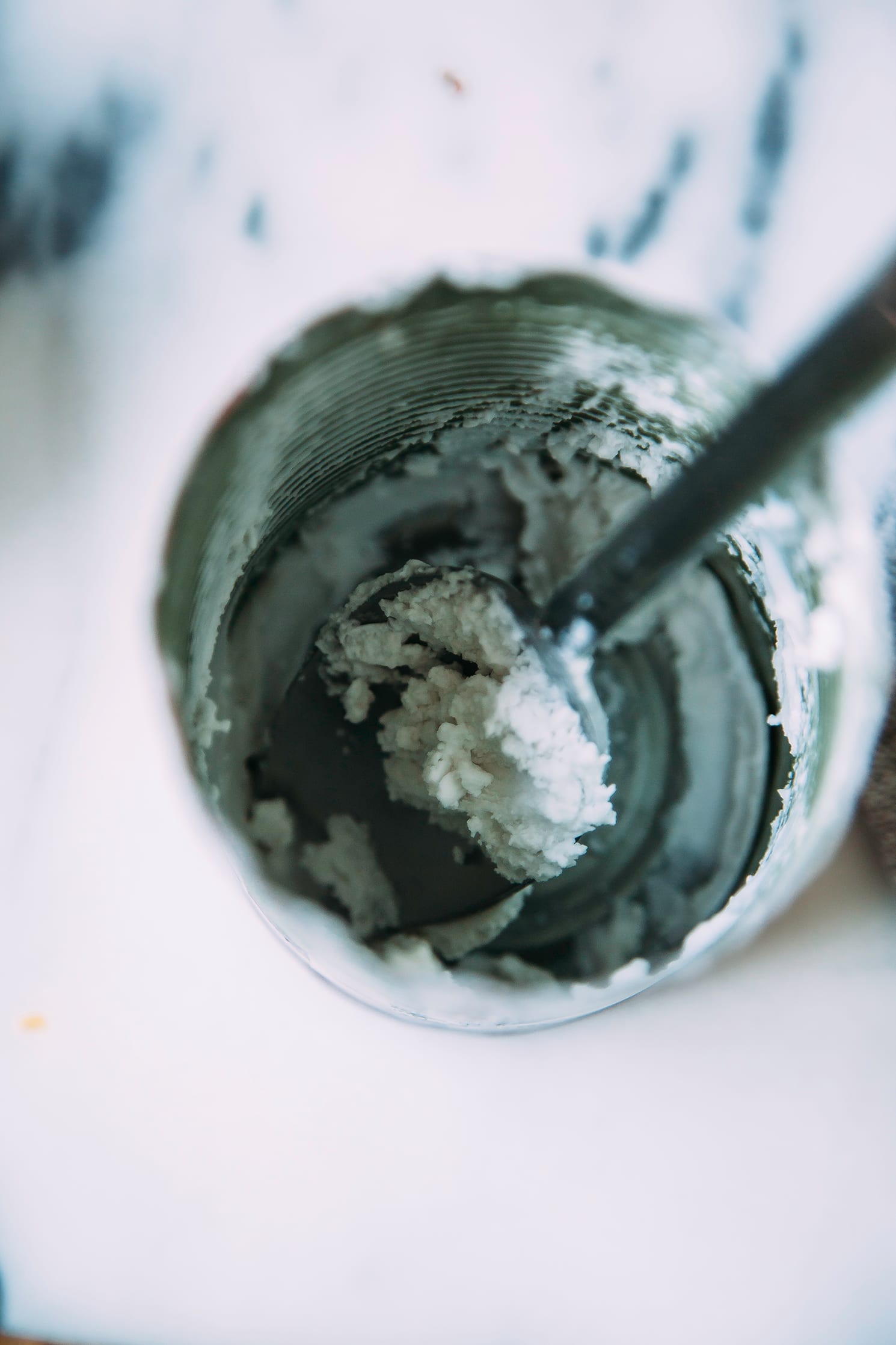 An overhead shot of an empty can of coconut cream.