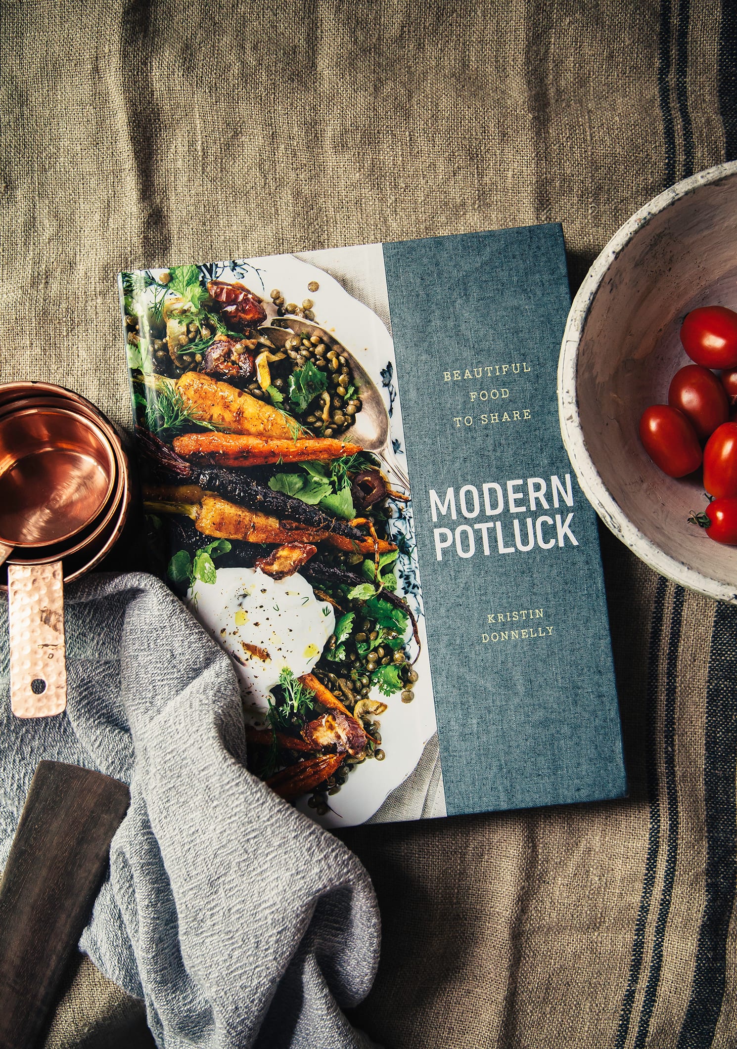 An overhead shot of the Modern Potluck cookbook by Kristin Donnelly
