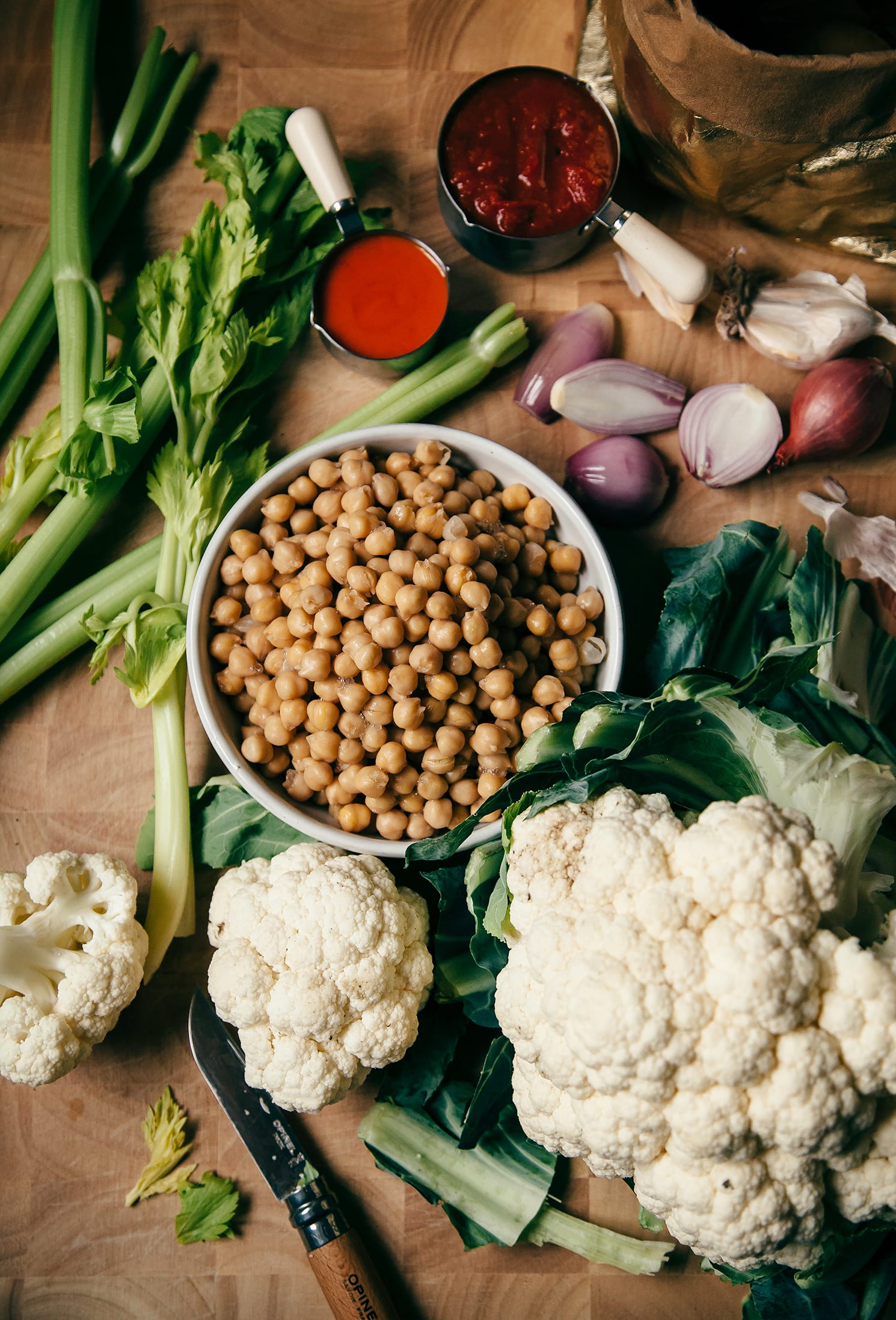 Overhead shot of ingredients for chickpea and cauliflower-stuffed baked potatoes.