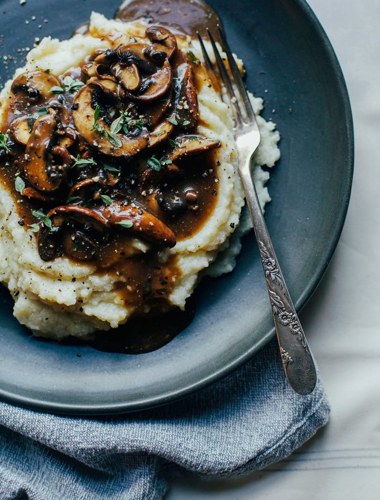 An overhead shot of vegan mushroom gravy on top of mashed potatoes.