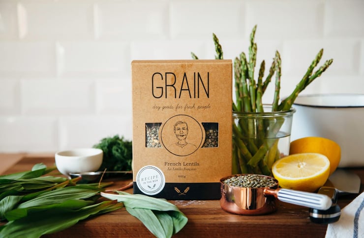 Image shows ingredients on a cutting board against a white tile background.