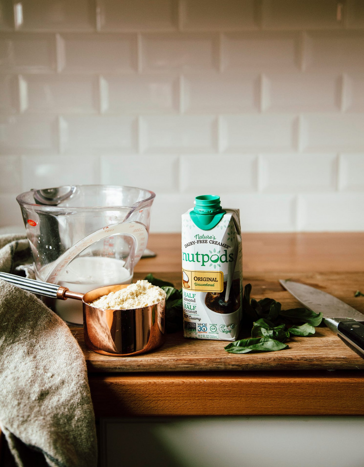 Image shows some dinner prep on a butcher block countertop.