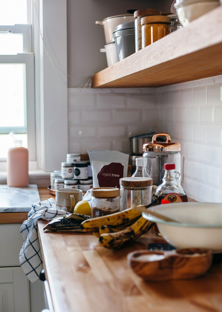 A kitchen scene shows cookie ingredients on a wooden kitchen counter.