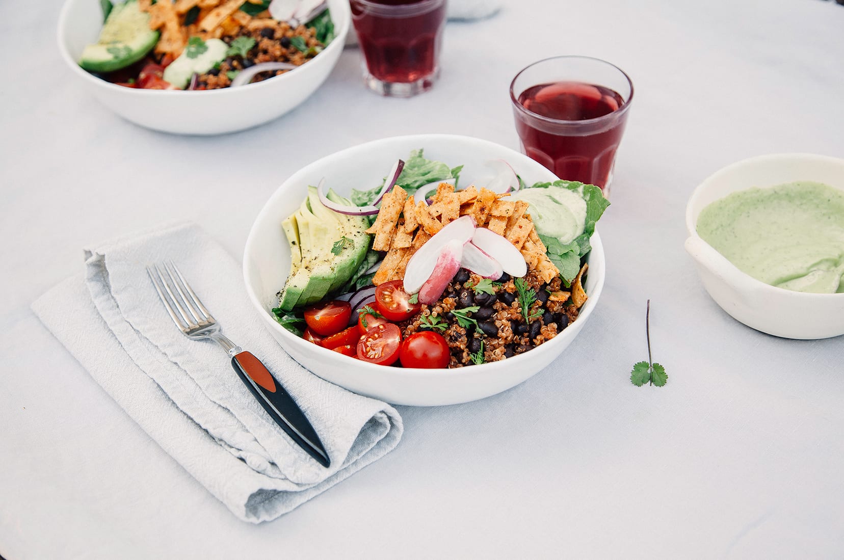 Fresh Taco Salads from "Love Real Food" (vegan recipe) A 3/4 angle shot of a vegan taco salad in a white bowl.