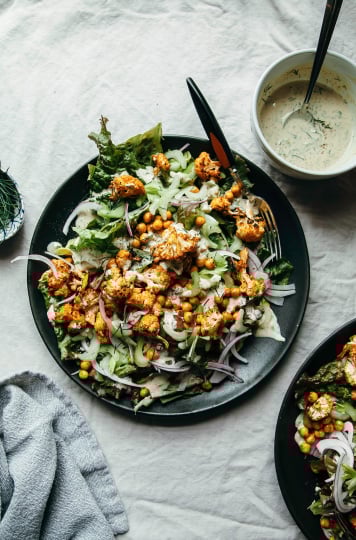 Buffalo cauliflower salad with chickpeas & tahini ranch (vegan) - The First Mess
