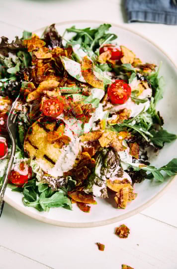 Vegan BLT salad with crispy coconut "bacon," tangy lemon pepper dressing, grilled peaches, and avocado - The First Mess