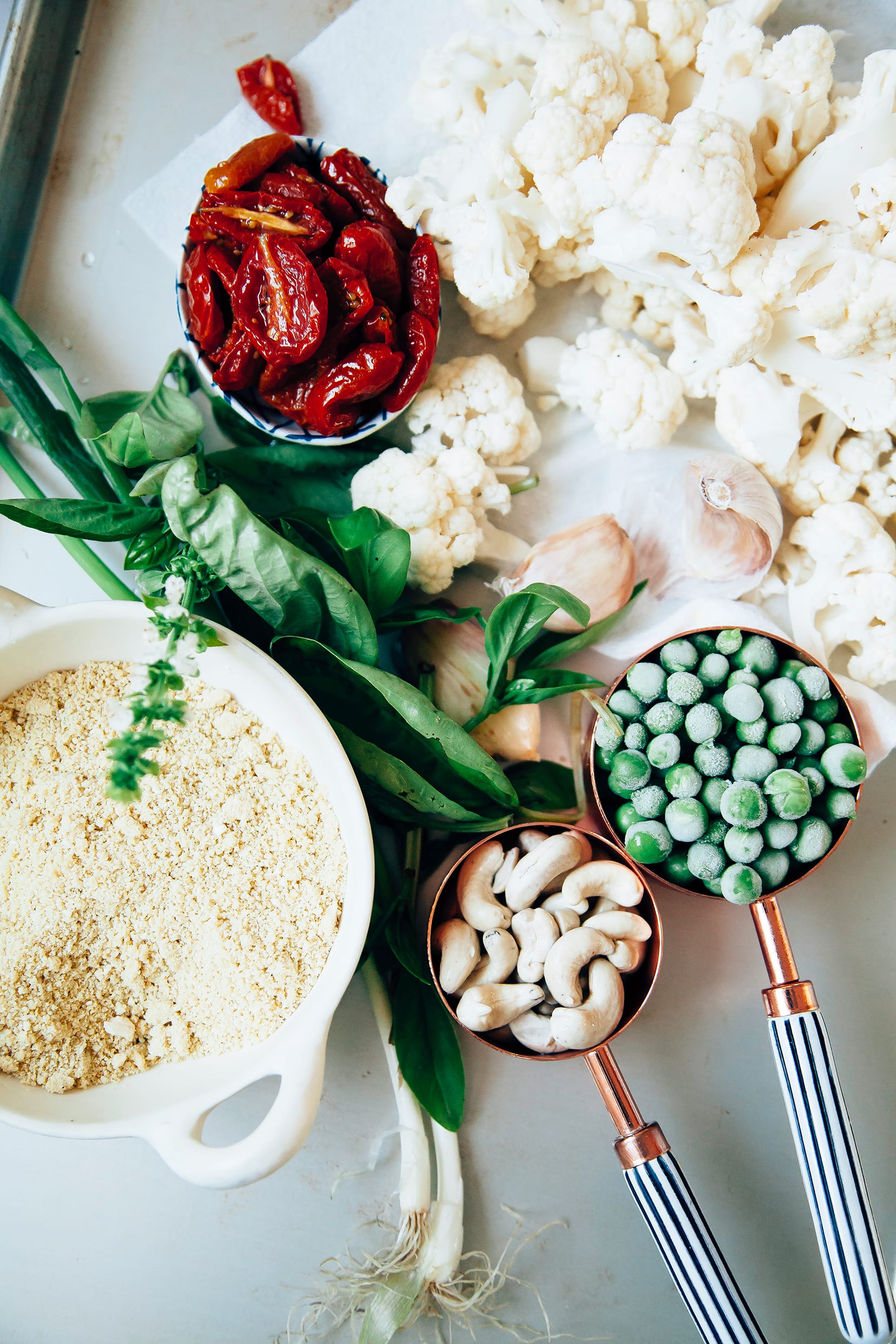 An overhead shot of ingredients for a creamy cauliflower pasta.