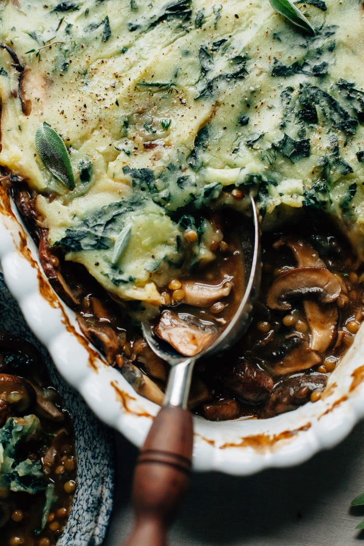 An overhead shot of a mashed potato topped mushroom casserole. Part of a roundup of vegan holiday recipes