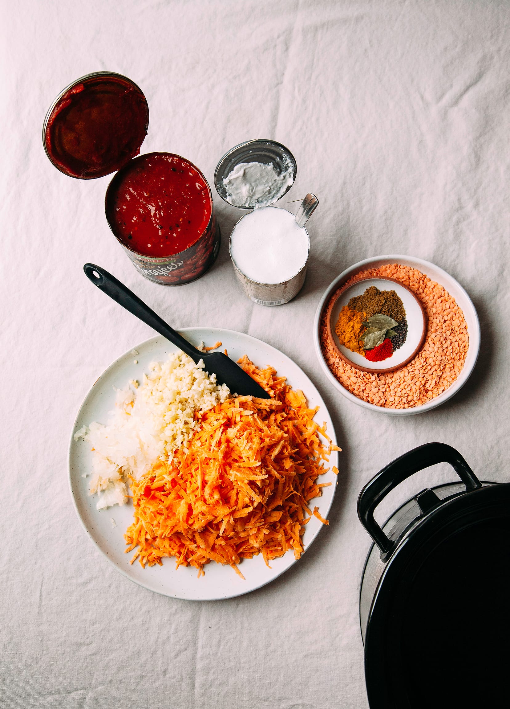 Image shows ingredients for a sweet potato and lentil soup.