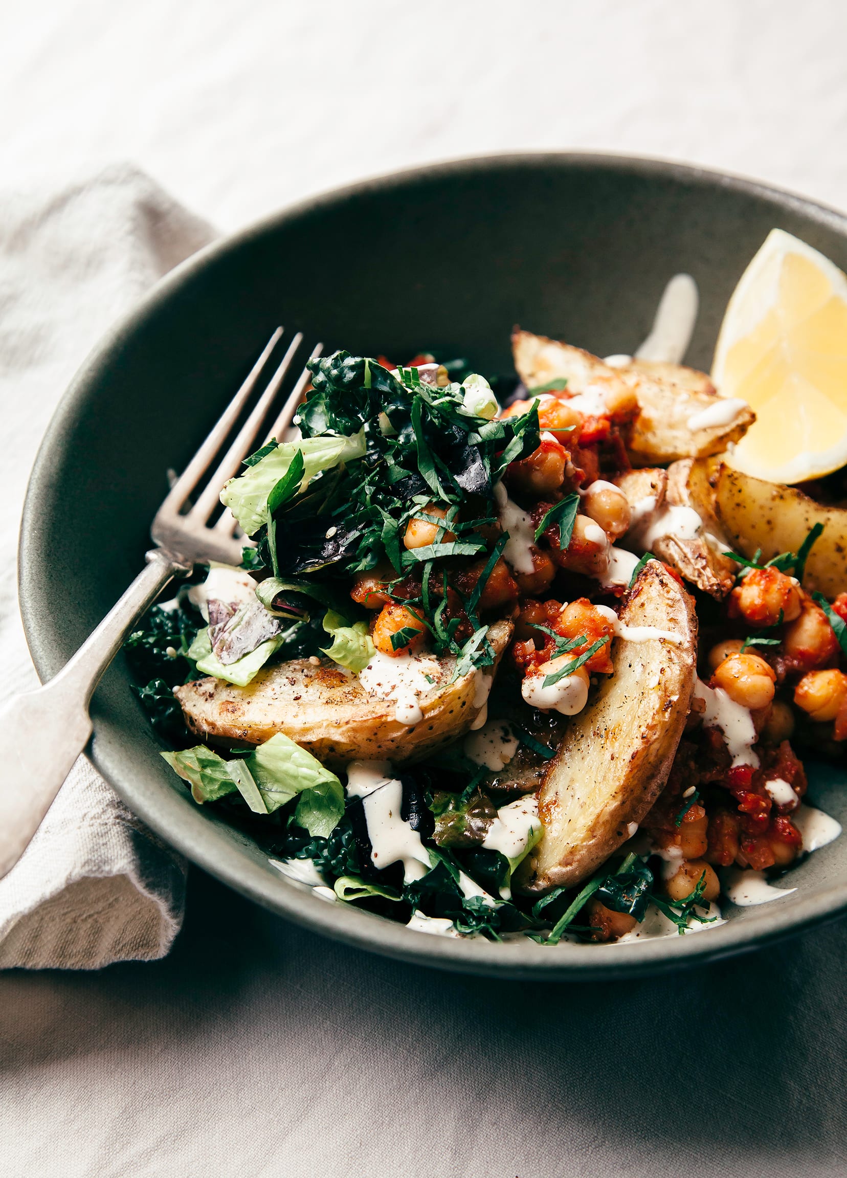 Harissa Chickpea Bowl with Potatoes, Lemon-y Tahini & Greens - The First Mess