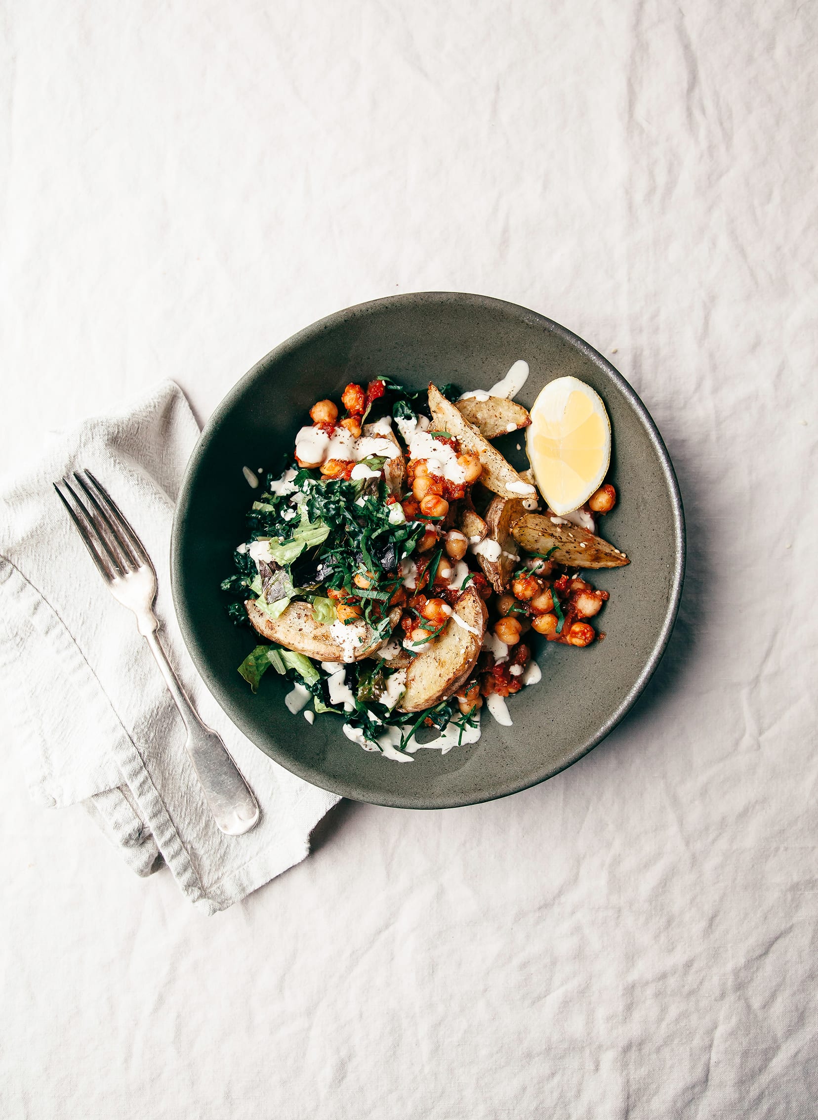 Harissa Chickpea Bowl with Potatoes, Lemon-y Tahini & Greens - The First Mess