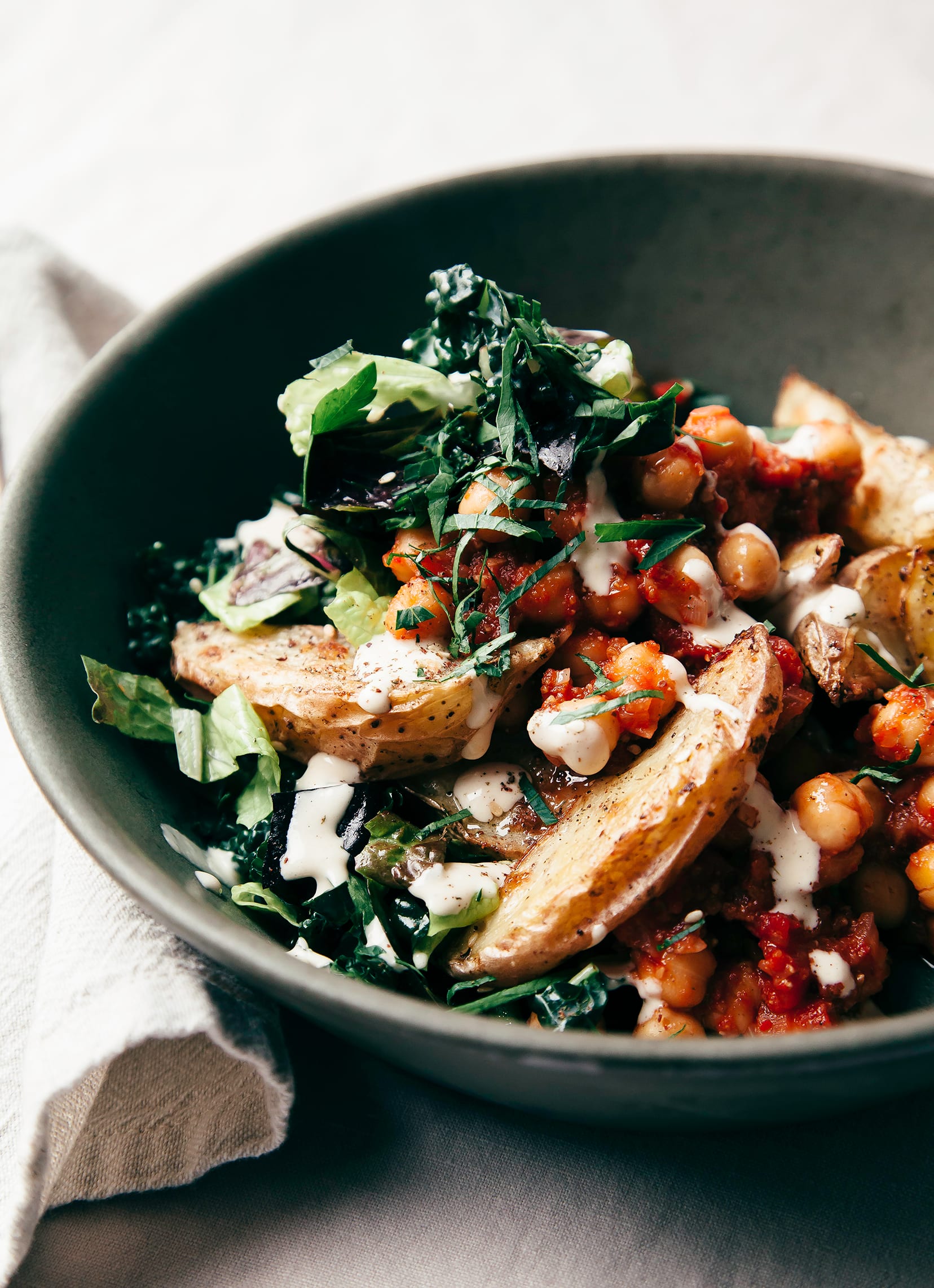 Harissa Chickpea Bowl with Potatoes, Lemon-y Tahini & Greens - The First Mess