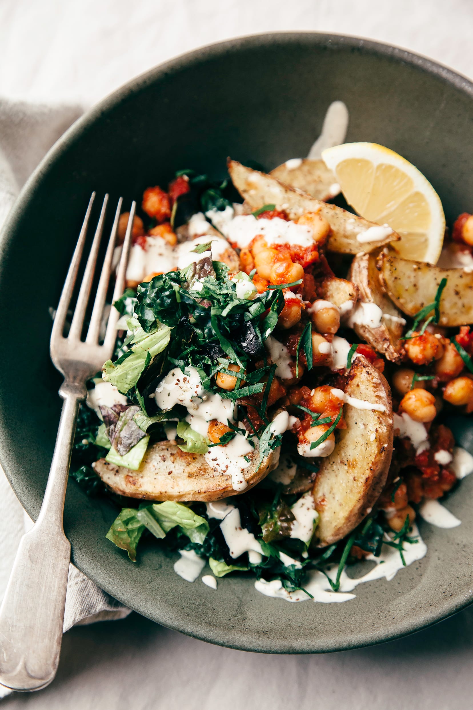 Harissa Chickpea Bowl with Potatoes, Lemon-y Tahini & Greens - The First Mess