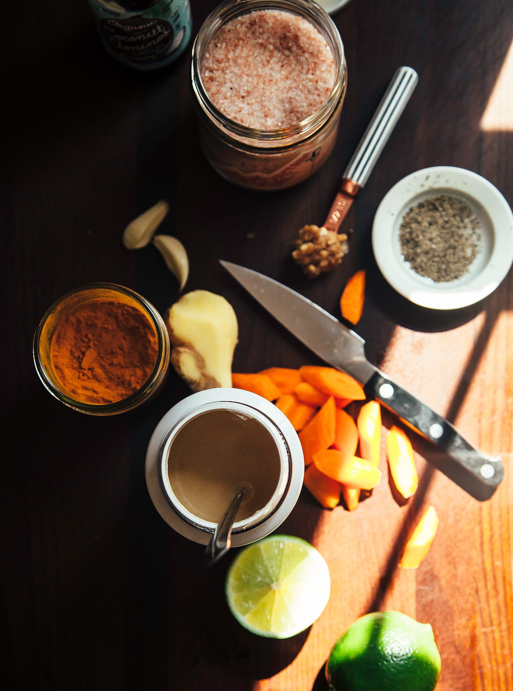 Overhead shot of ingredients for a sunshine tahini sauce.