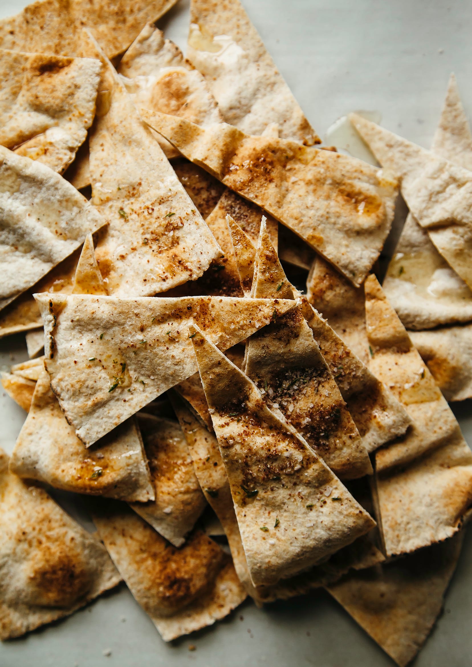An up close, overhead shot of homemade pita chips.
