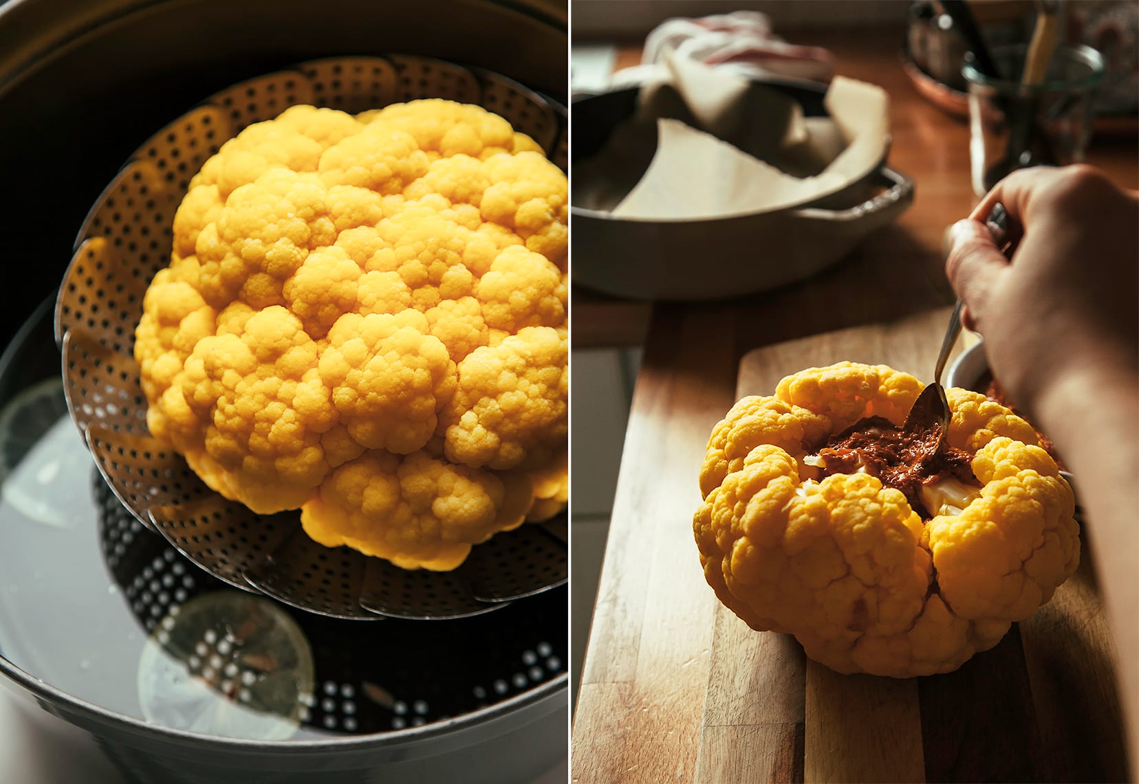 Image shows a whole steamed cauliflower as well as a hand spooning romesco into the core of the cauliflower.