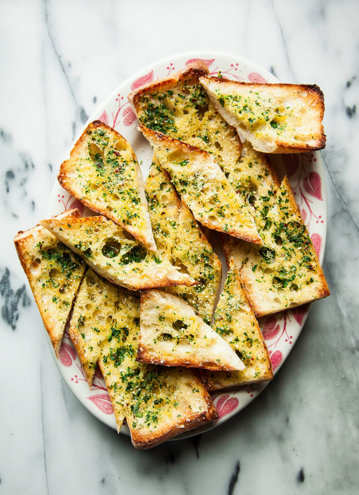 An overhead shot of a platter of garlic bread.