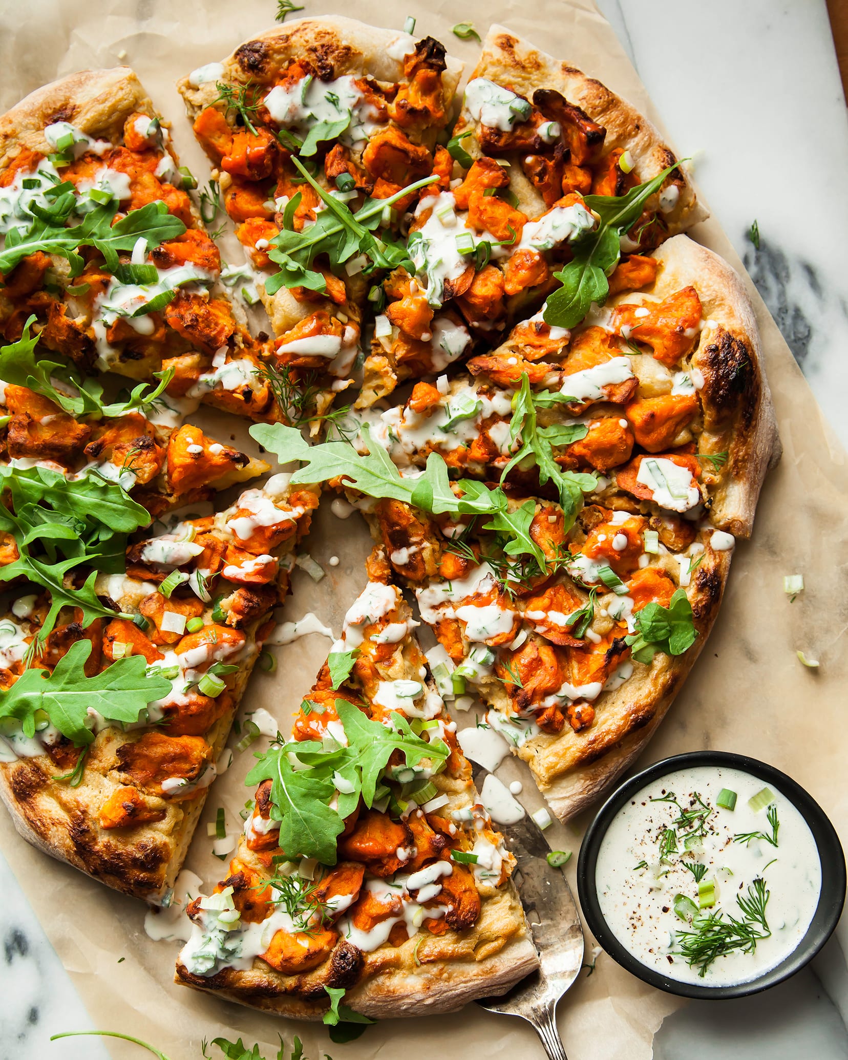 VEGAN BUFFALO CAULIFLOWER PIZZA W/ ONION CREAM - The First Mess