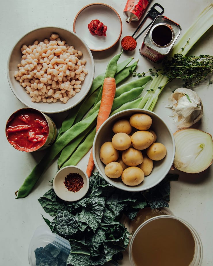 An overhead shot of ingredients for a white bean stew.