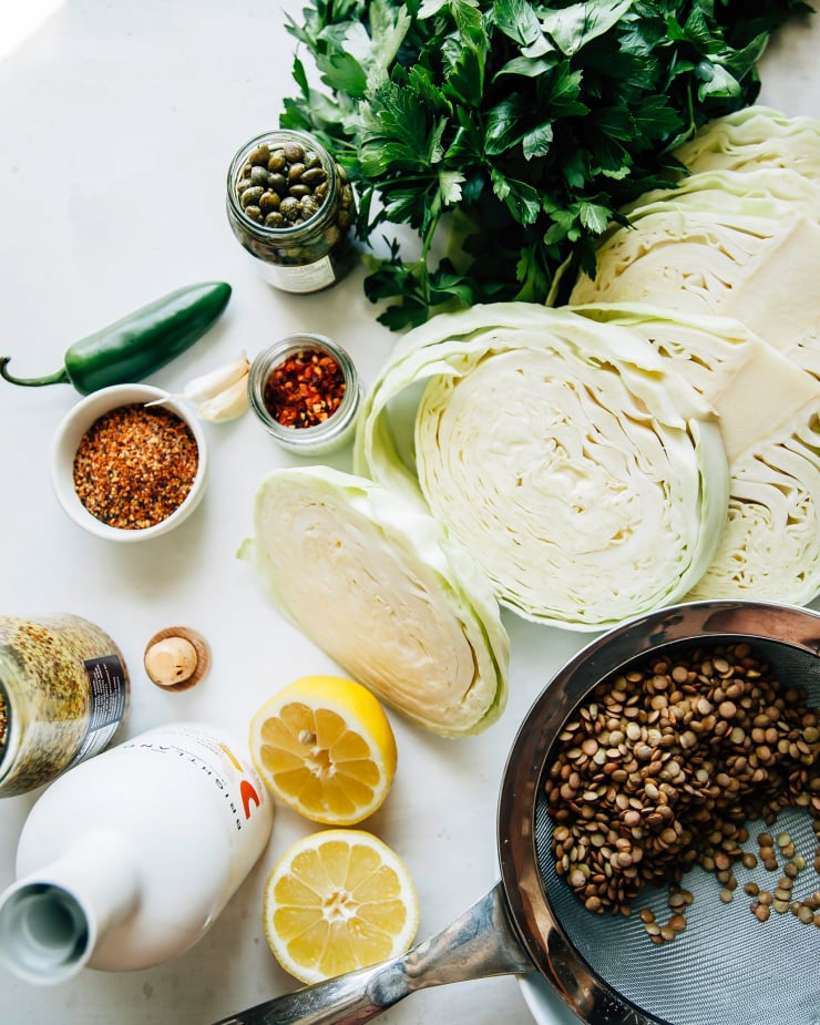 Image taken from overhead shows ingredients for a grilled cabbage dish.