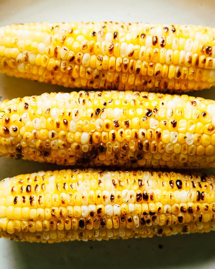 An up close, overhead shot of charred corn cobs.
