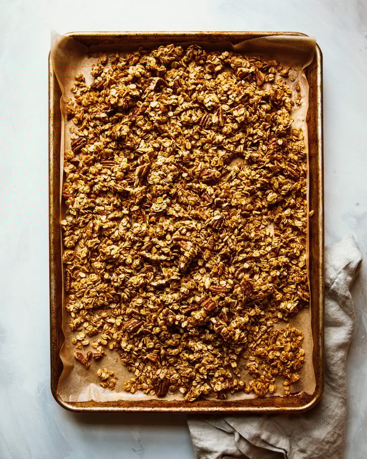 An overhead shot of a sheet pan with granola.