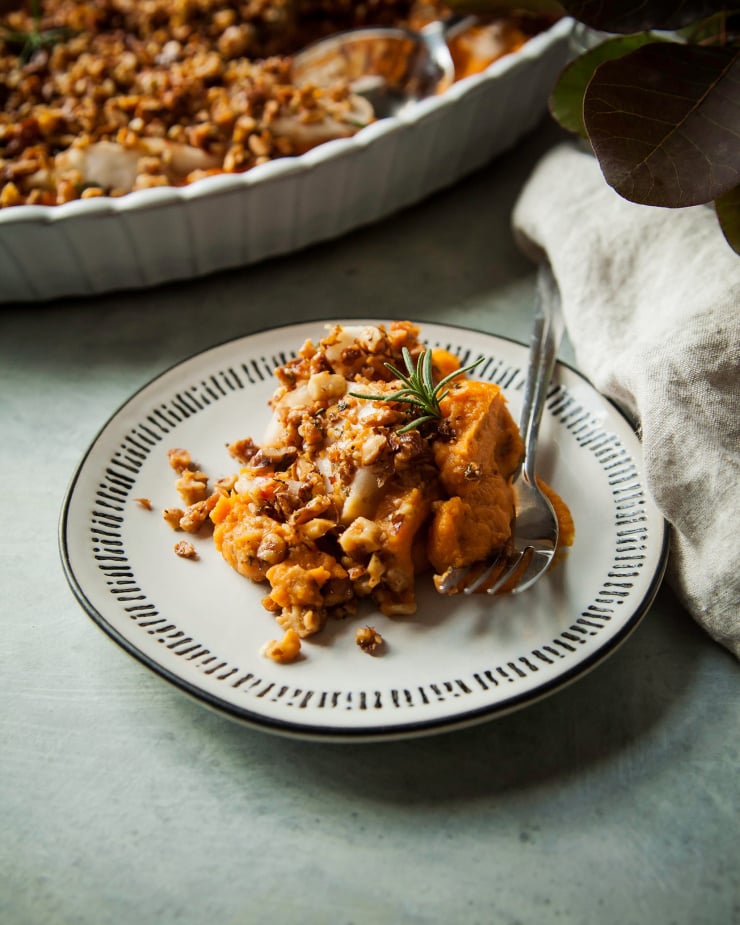 Image shows a single serving of sweet potato casserole on a plate.