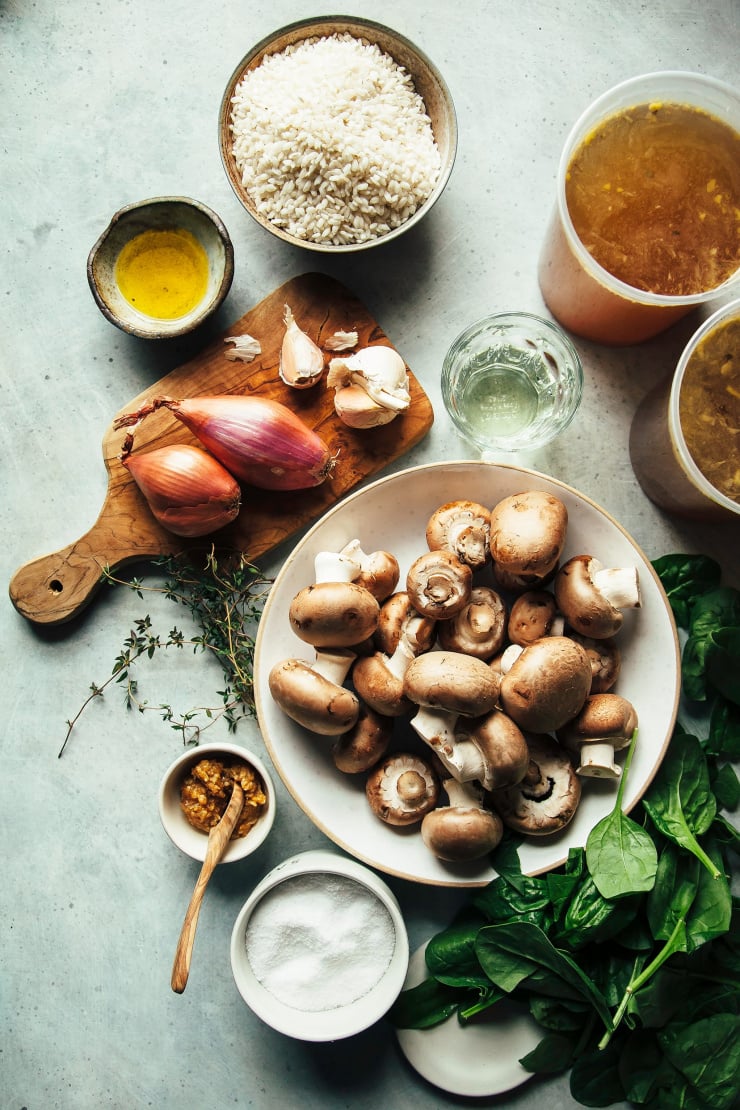 An overhead shot of ingredients for a vegan mushroom risotto.