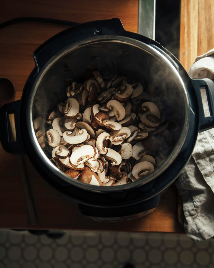 An overhead shot of mushrooms inside of an Instant Pot.