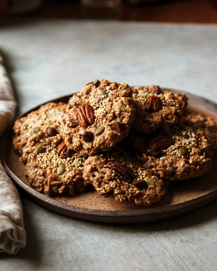 A side angle shot of a plate of wholesome cookies.