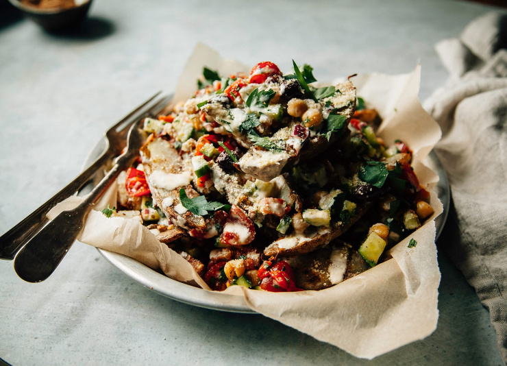 Loaded shawarma-spiced fries with crunchy veg salad and lemony tahini