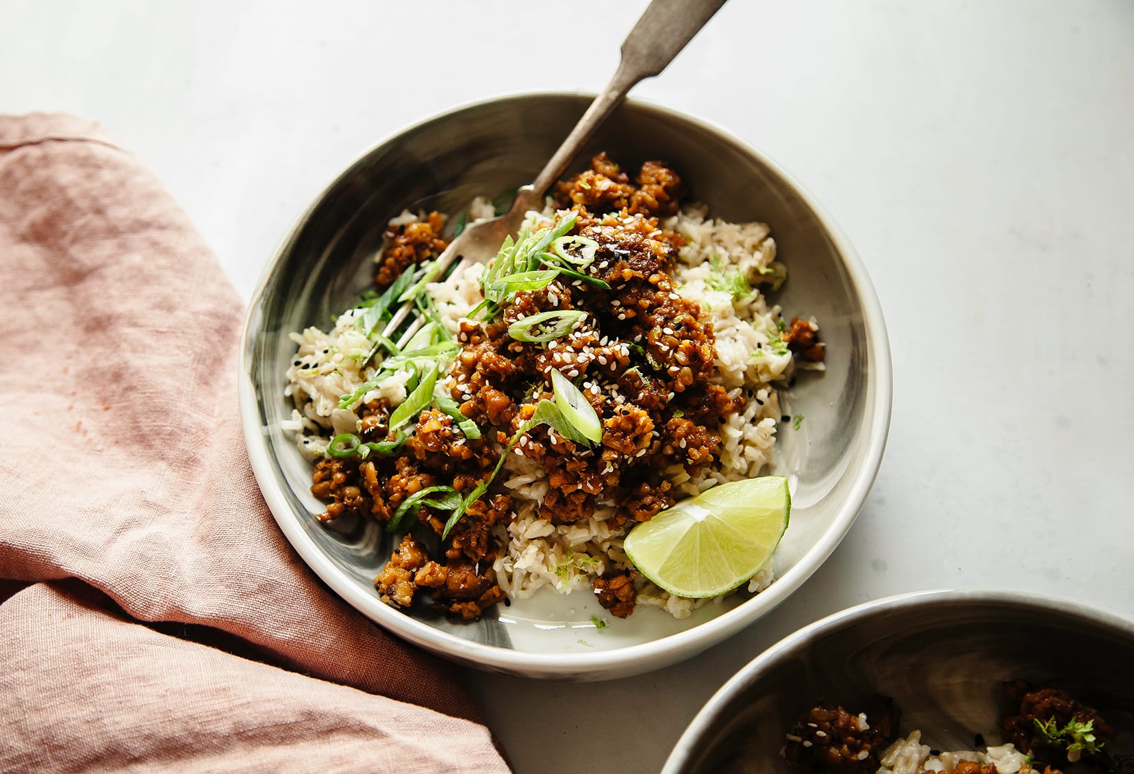 A bowl of sticky ginger tempeh with coconut rice.