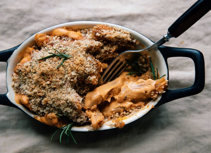 An up close shot of the baked pasta with a fork digging into it.