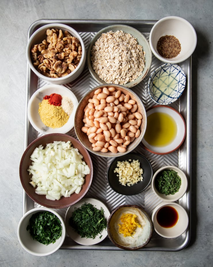 An overhead shot of prepped and measured ingredients on a baking sheet.