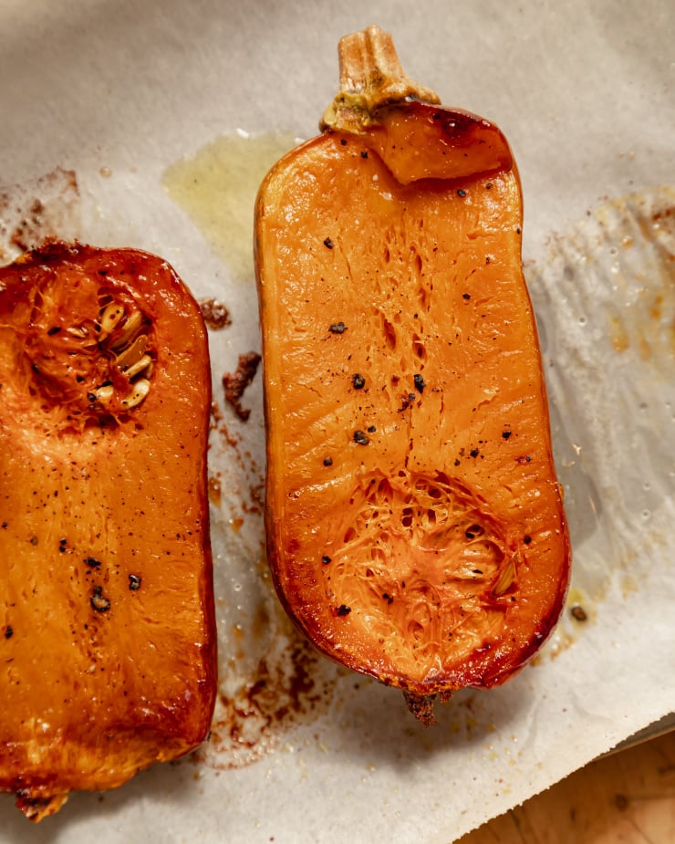 An overhead shot of a roasted honey nut squash half.