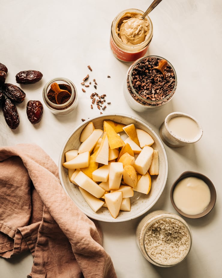 An overhead shot of ingredients used in a creamy vanilla chip smoothie.