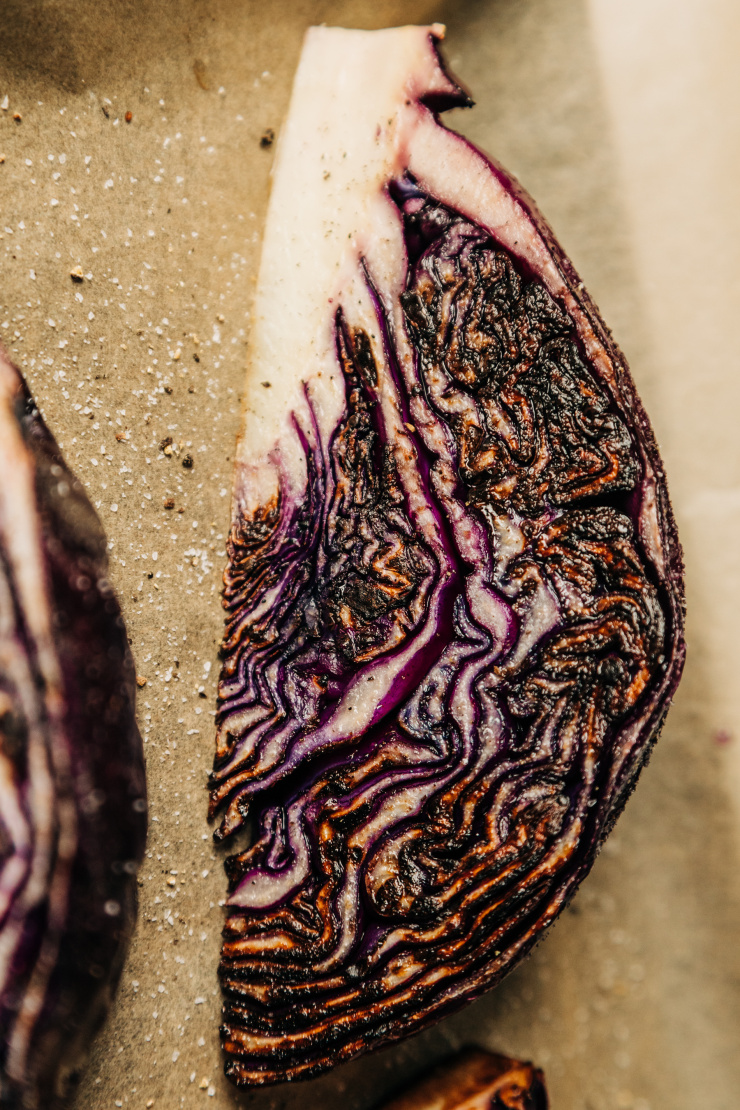 An up close, overhead shot of a seared wedge of red cabbage.