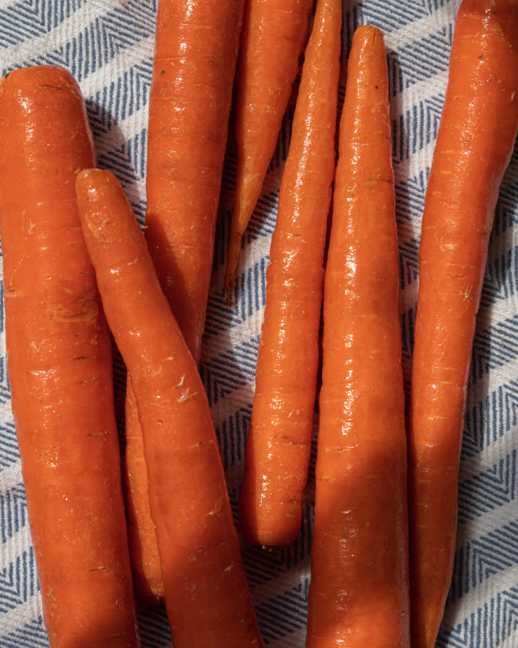 An up close, overhead shot of wet carrots.