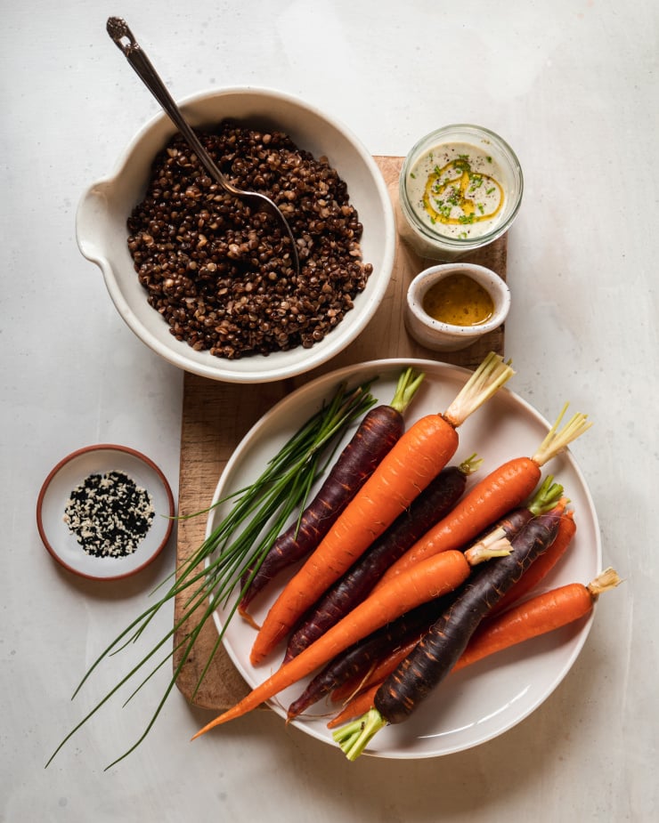 An overhead shot of prepped ingredients for a grilled carrots dish.