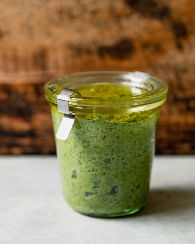 A head-on shot of a closed Weck jar filled with vegan pesto.