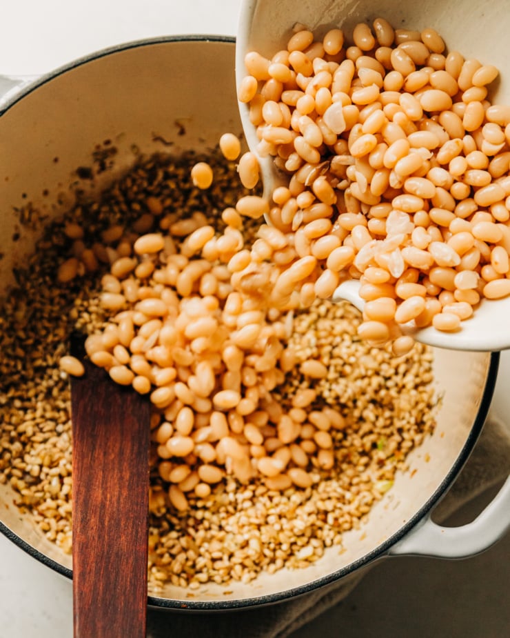 An overhead image shows white beans being poured into a pot.