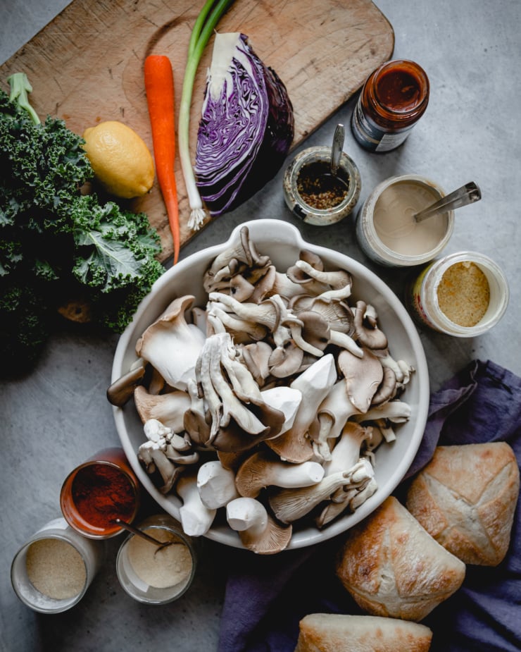 An overhead shot of ingredients used in crispy BBQ pulled mushroom sandwiches with tahini ranch slaw.