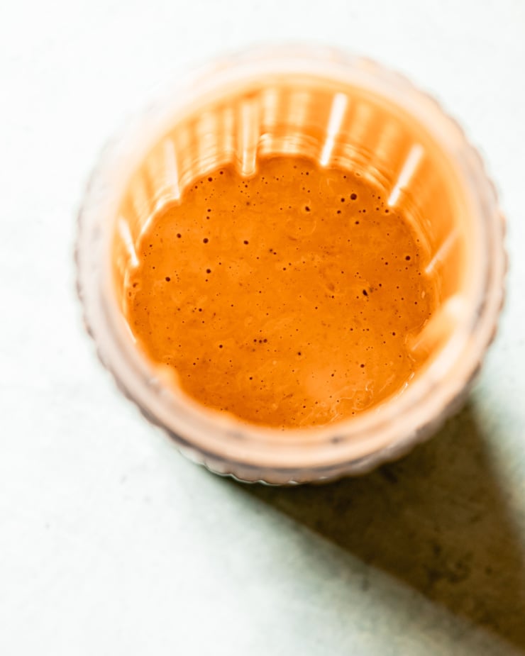 An overhead shot shows a blended sauce in a blender jar.