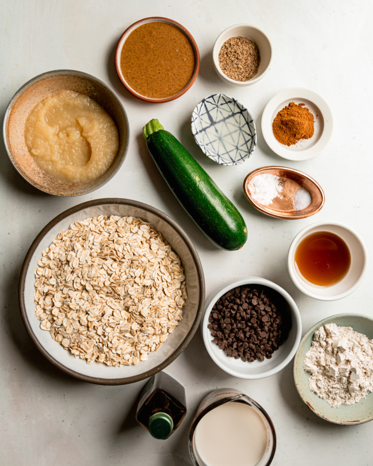An overhead shot shows ingredients used in a zucchini baked oatmeal cups recipe.